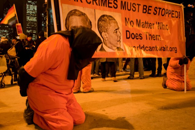 Activists are dressed up as prisoners to protest American torture in Chicago on Dec.10, 2014. Around 200 anti-violence activists held a peaceful assembly on the International Human Rights Day in Chicago. Some of them protested against the grand jury decisions in the death of Michael Brown in Fugerson, Missouri and also chokehold death of Eric Garner in New York. Other activists also blamed U.S. involvement in the Middle East, protested the U.S. torture used by the CIA revealed in a Tuesday's report since the Sept. 11, 2001 terror attack. (Xinhua/He Xianfeng) XINHUA /LANDOV