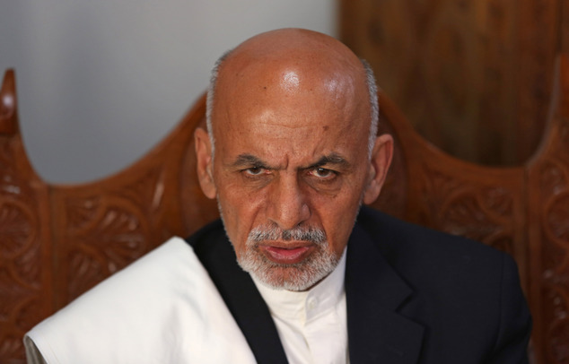 Afghan presidential candidate Ashraf Ghani Ahmadzai talks during an interview with The Associated Press at his resident in Kabul, Afghanistan, Thursday, April 3, 2014. A leading Afghan presidential candidate praised Hamid Karzai for allowing the country's first democratic transition of power and said he'll offer the longtime leader an advisory role if he wins. (AP Photo/Massoud Hossaini)